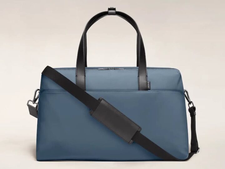 blue bag with handles and shoulder strap