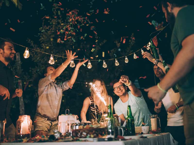 people celebrating in backyard at night