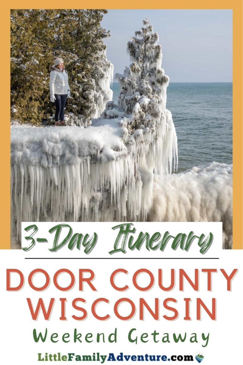 woman standing on icy cave point park for door county winter getaway