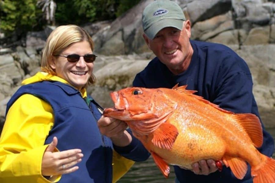 couple holding large rockfish