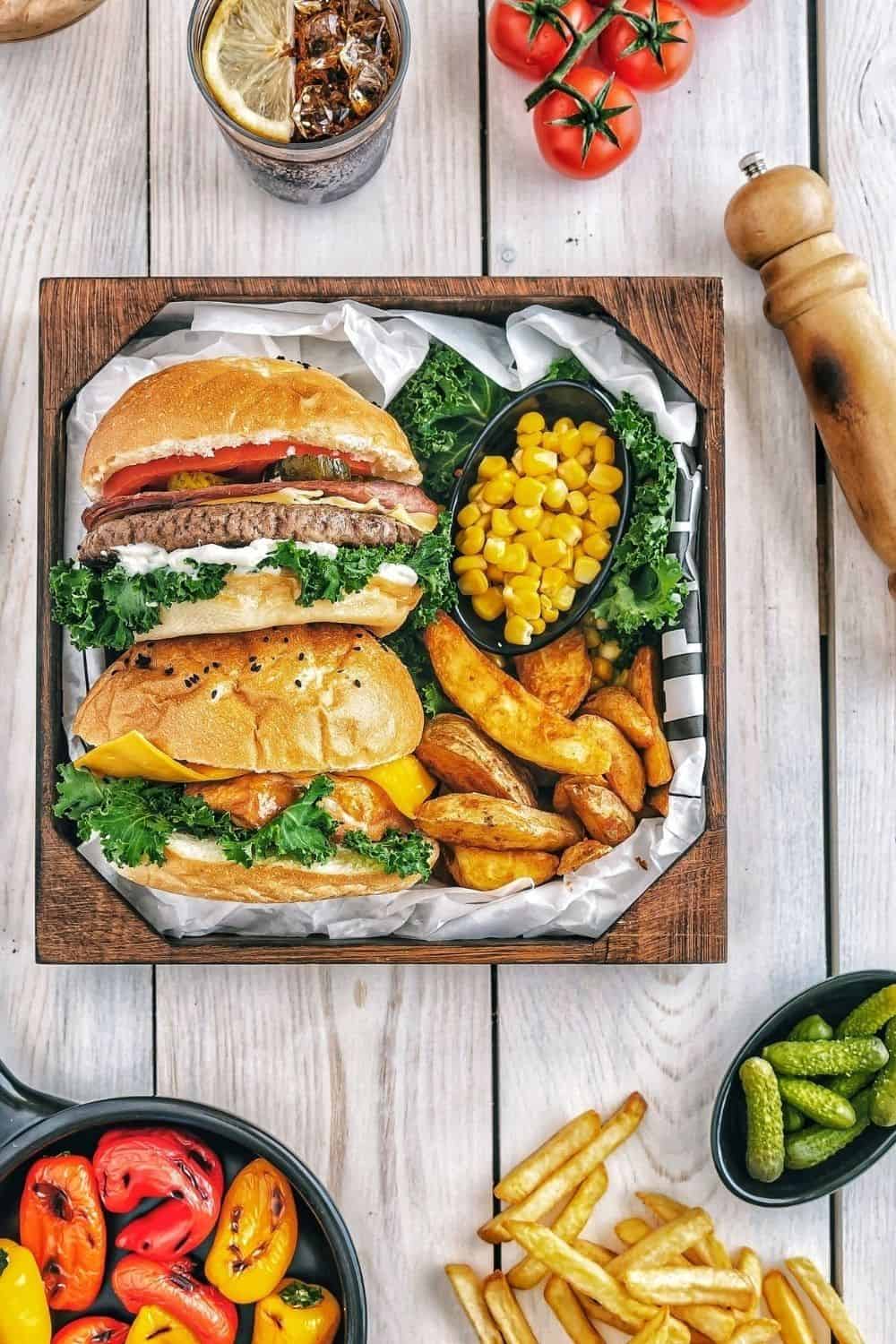 Grilled hamburger with side dishes