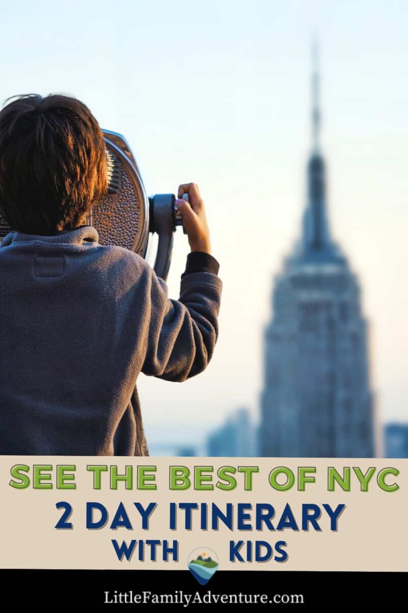boy looking at viewfinder towards Empire State Building