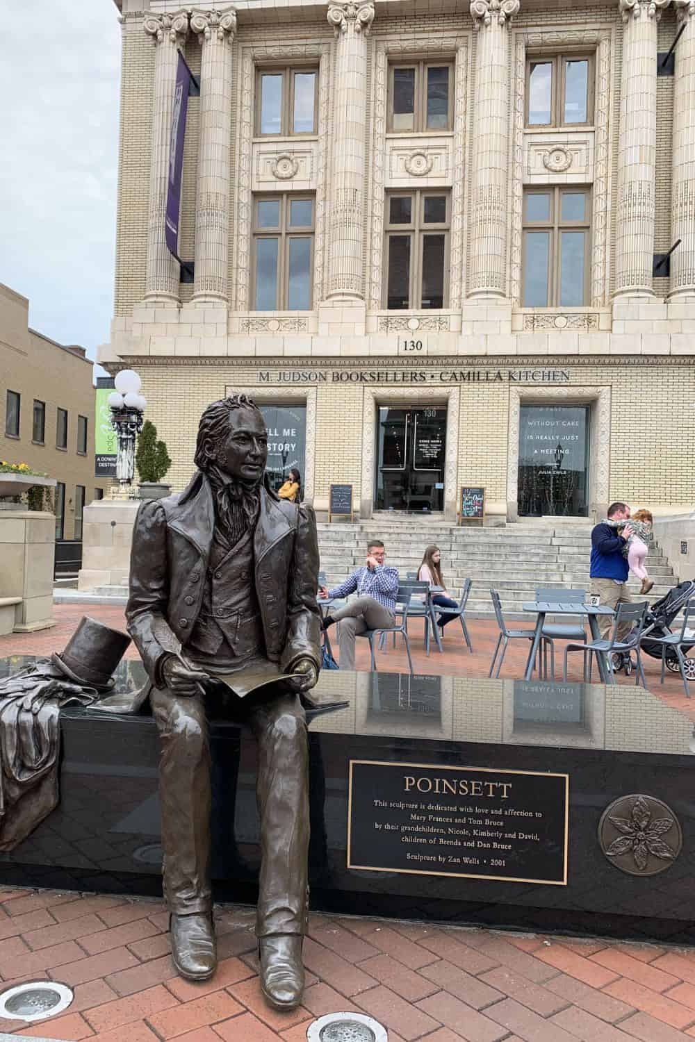 poinsett statue in front of mjuson booksellers store