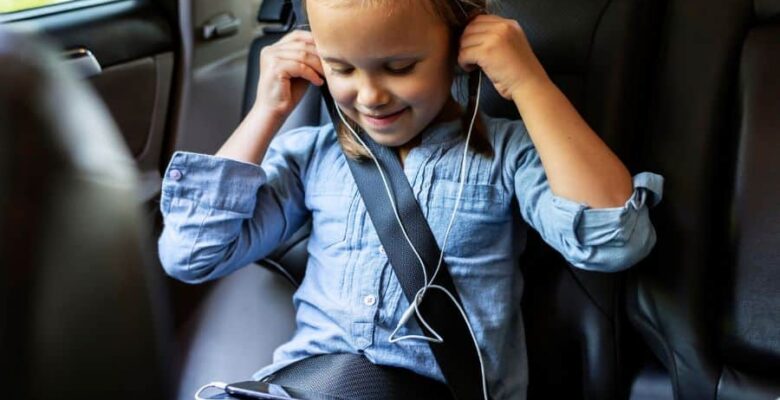 girl listening to music on a road trip