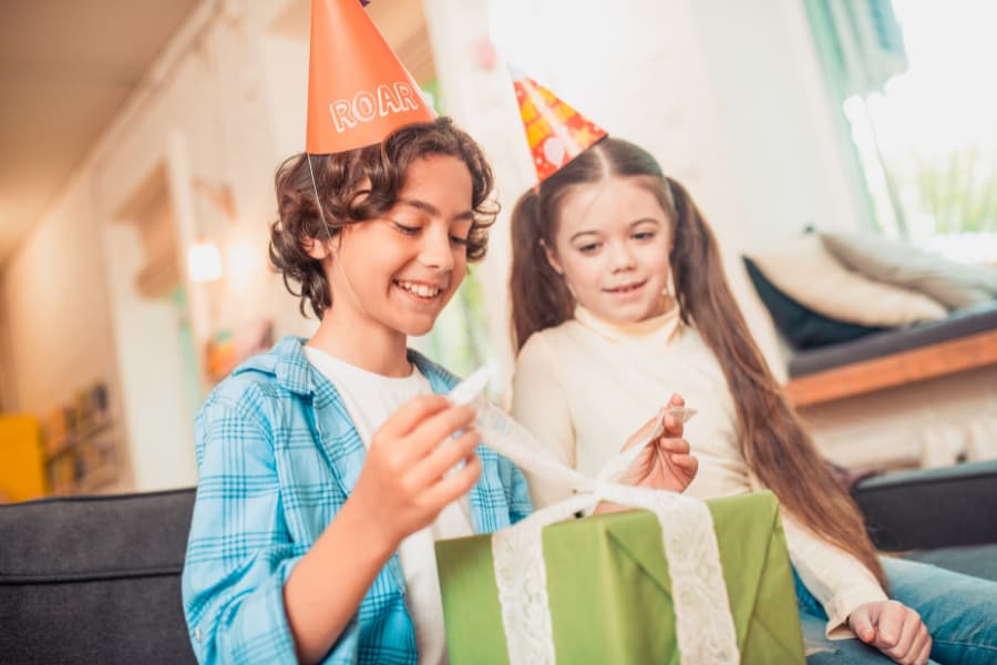 boy and girl opening gifts