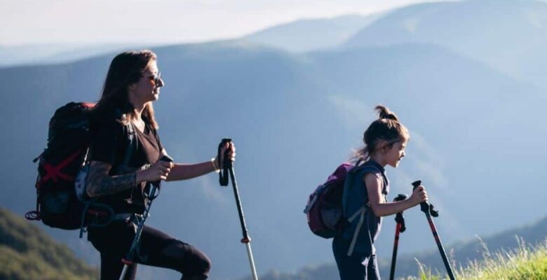 mother daughter hike with trekking poles