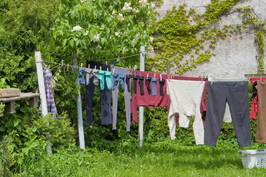 hanging clothes outside on a line to remove smoky smell