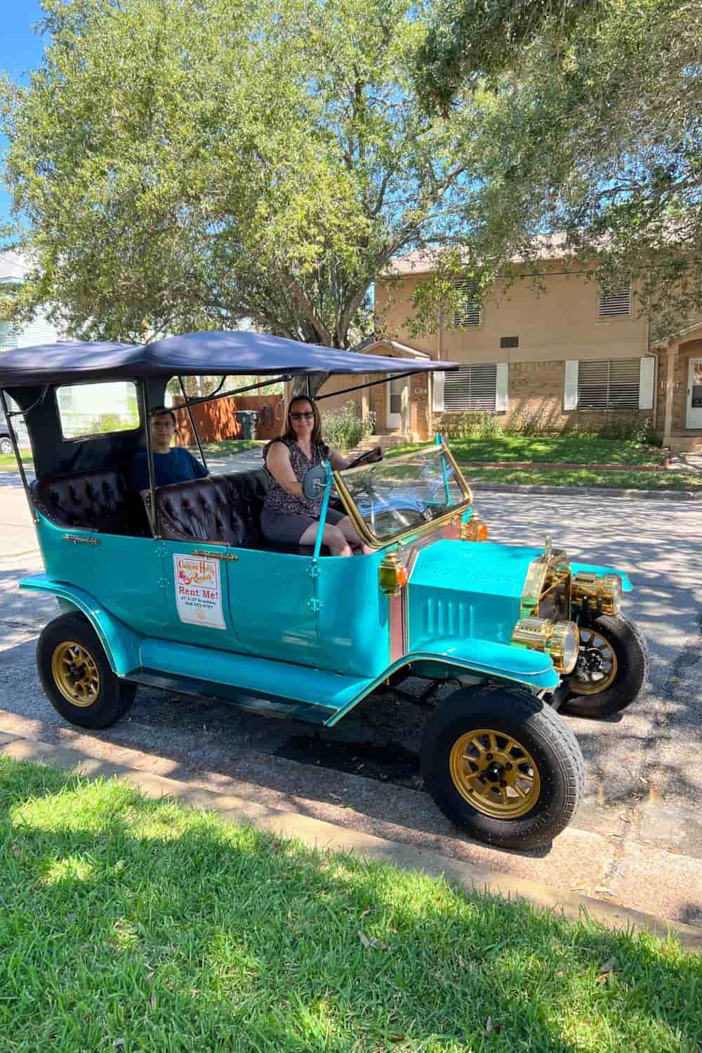 author in a turquoise model t car