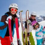 females on mountain with ski gear