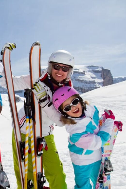 females on mountain with ski gear