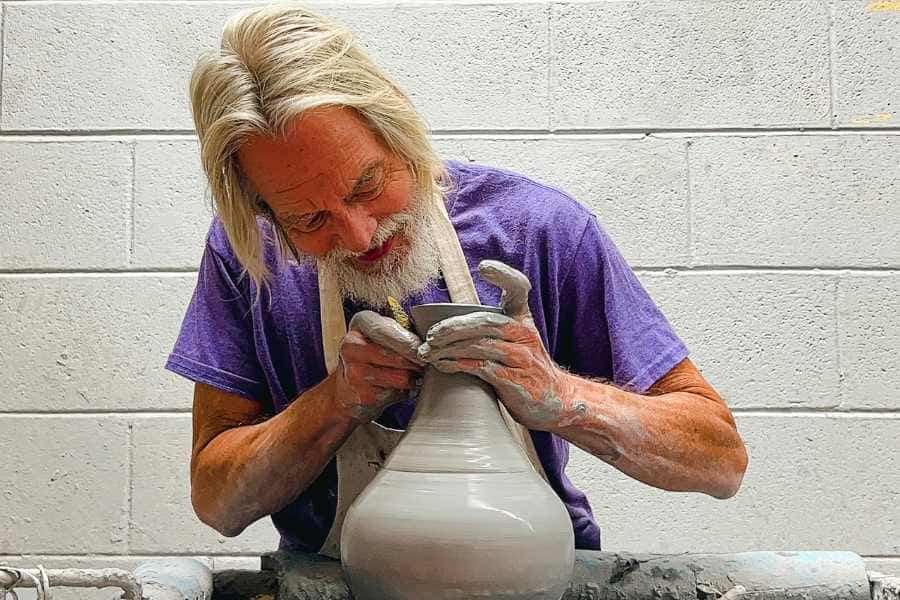 james dryen man sculpting ceramic vessel