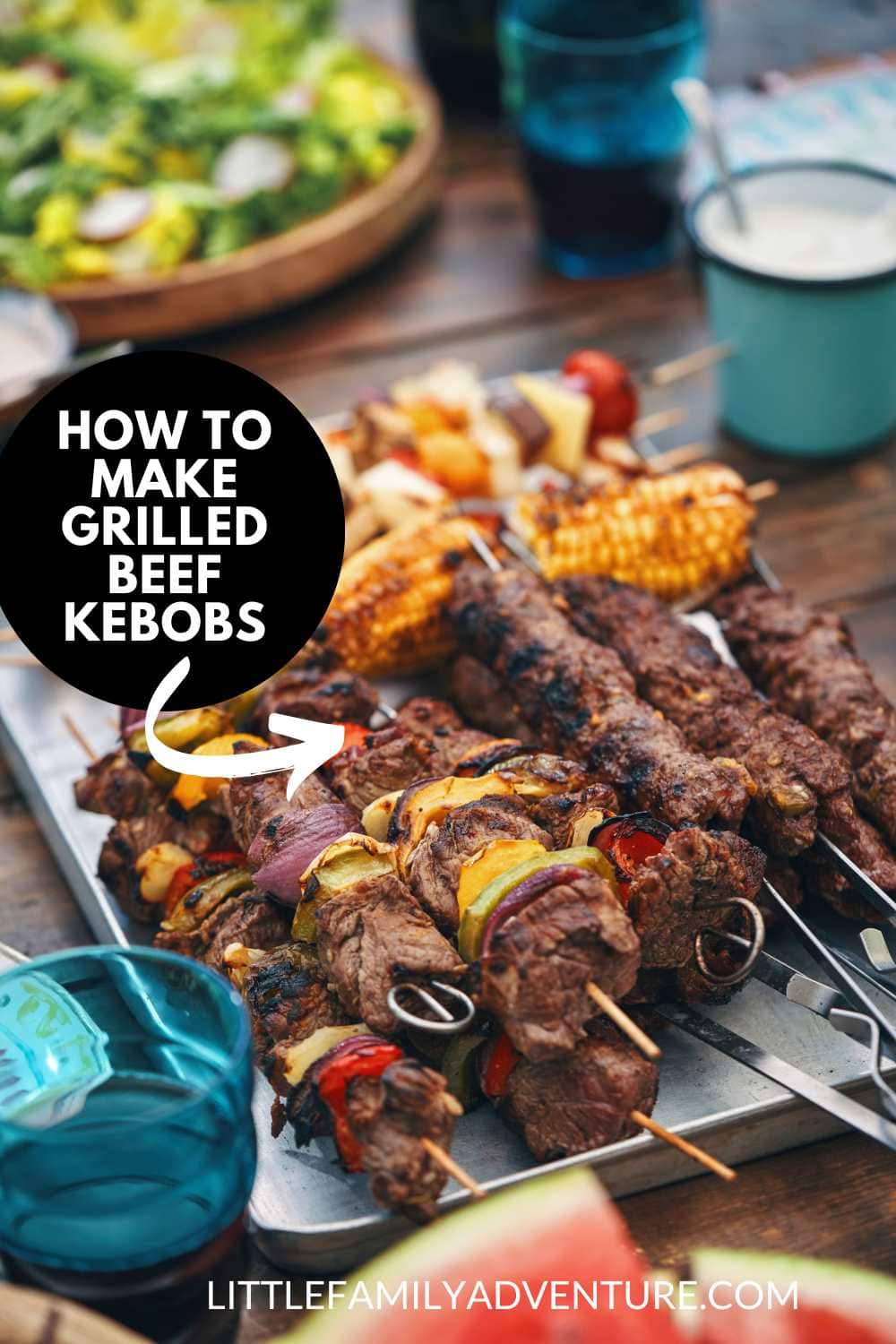 metal skewers of beef kebobs on table for barbecue