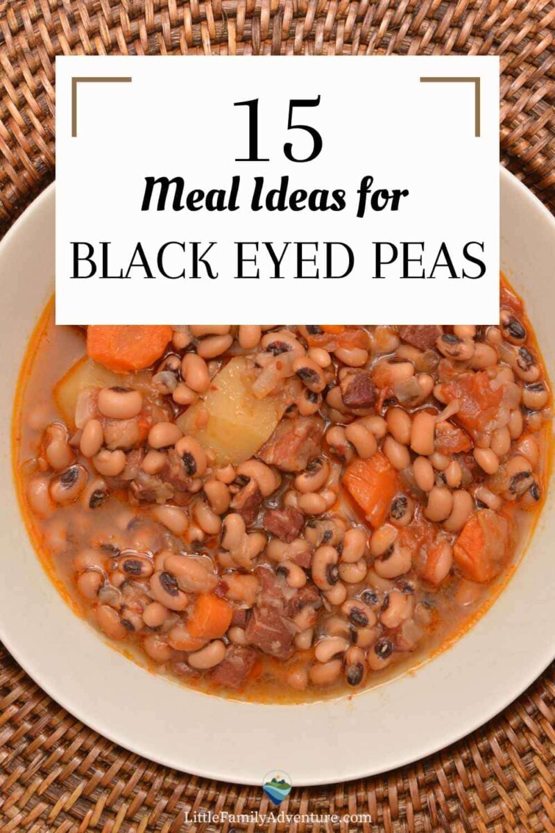 white bowl of black eyed peas with carrots and potatoes