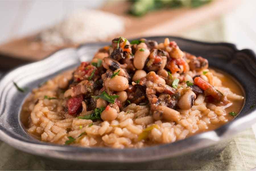 bowl of black eyed peas with rice and stew meat
