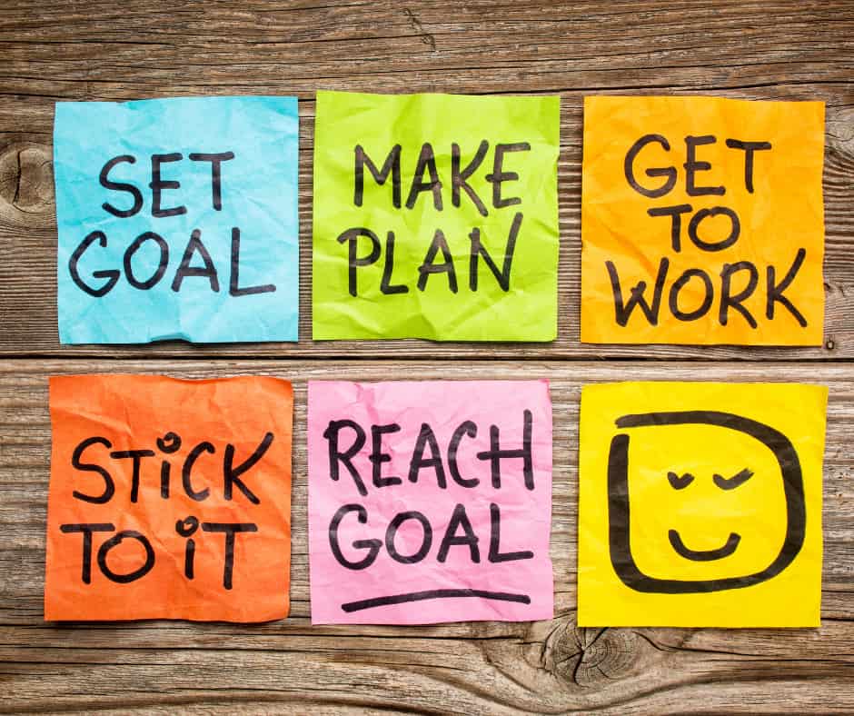 bright colored post it notes on table about setting goals