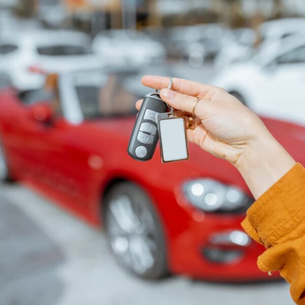 car rental keys in front of convertible