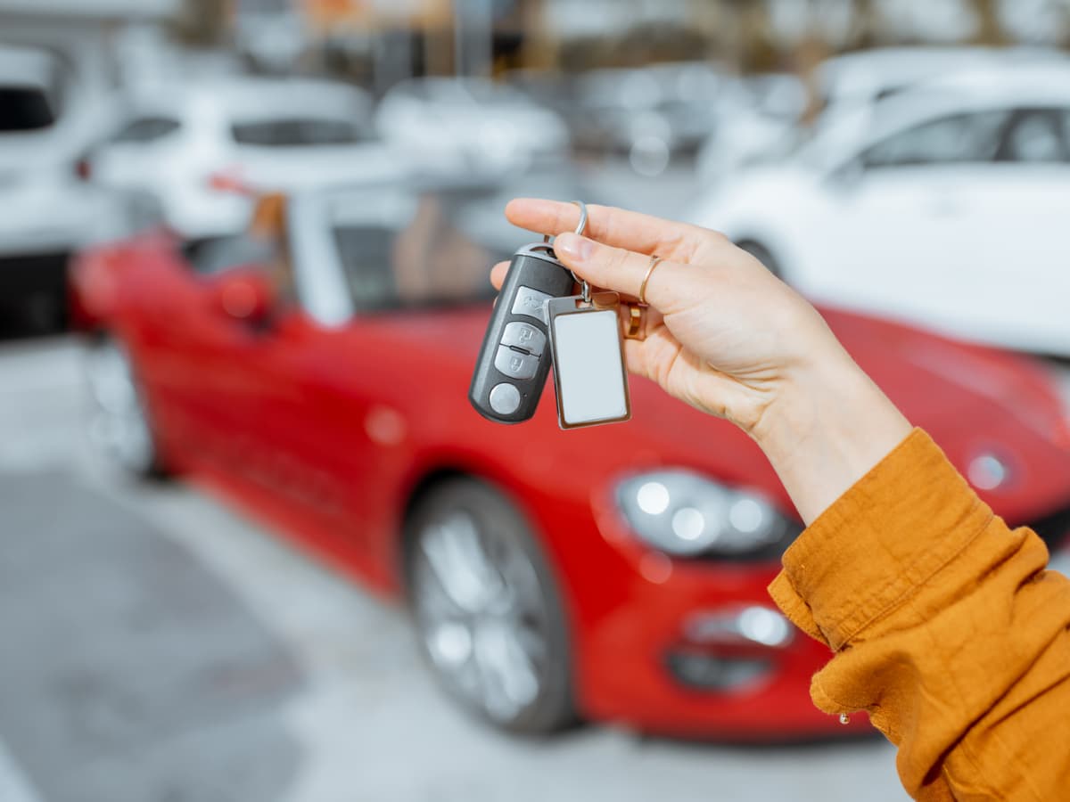 car rental keys in front of convertible