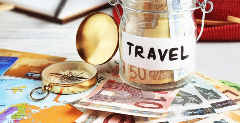 travel fund jar with cash underneath