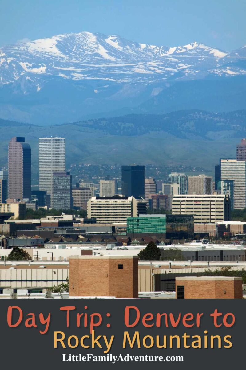 city scape of Denver colorado with rocky mountains in background