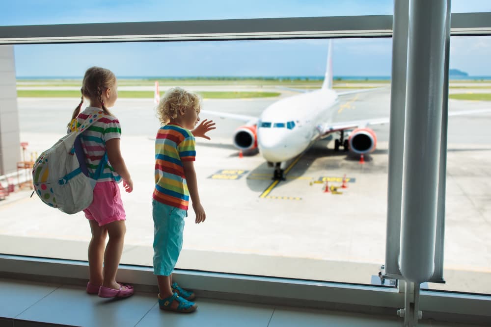 children-looking-at-airplane