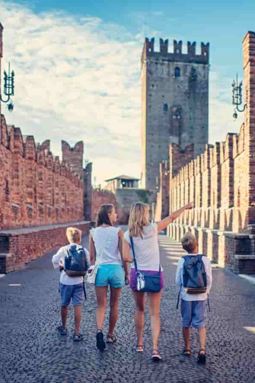 Woman and three children in Verona - best cities to visit in Italy
