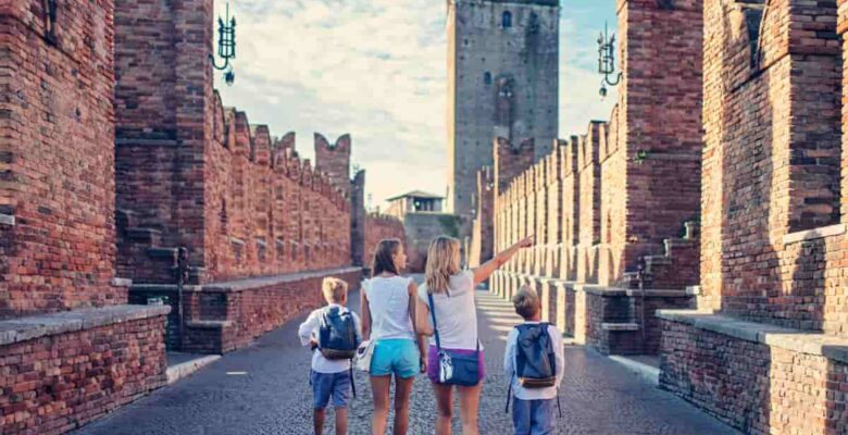 Woman and three children in Verona - best cities to visit in Italy
