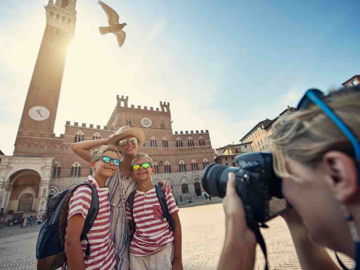 family taking pictures in Siena