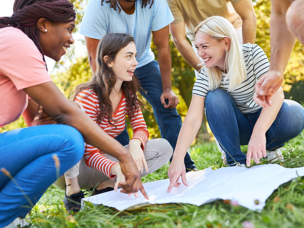 teens searching for geochache on map