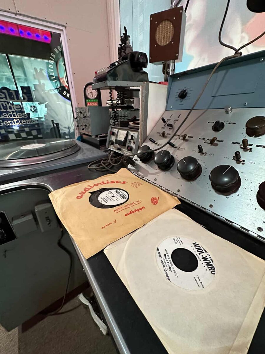 Vinyl records once played at the WAJP FM Studio on display at Illinois Rock & Roll Museum 