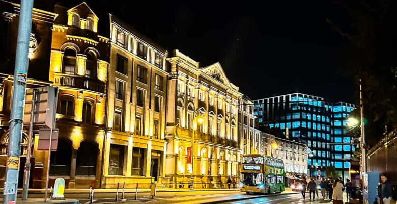what to see in Dublin - cityscape at night with buildings and bus