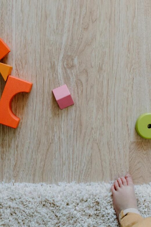 kid friendly space - toddler feet and blocks on a floor
