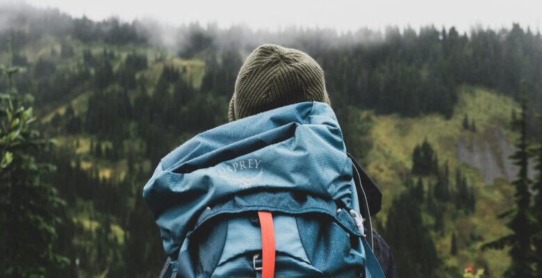 teen with backpack in forest