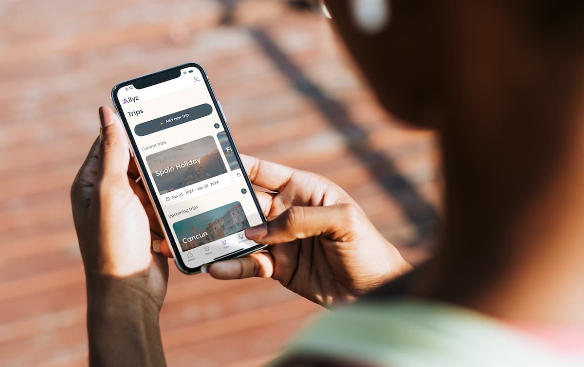 Allyz app displayed in a woman's hands