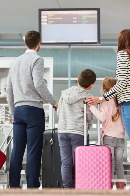family packed for flight at airport
