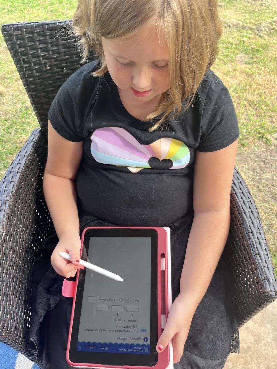 girl on the smile zemi math tablet