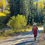 paved trail in Vail with woman walking dog