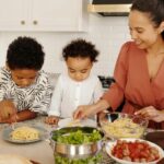 woman and children cooking togethers
