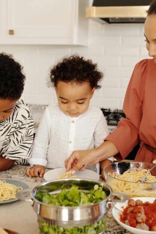 woman and children cooking togethers
