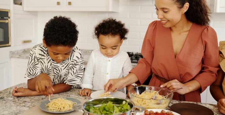woman and children cooking togethers