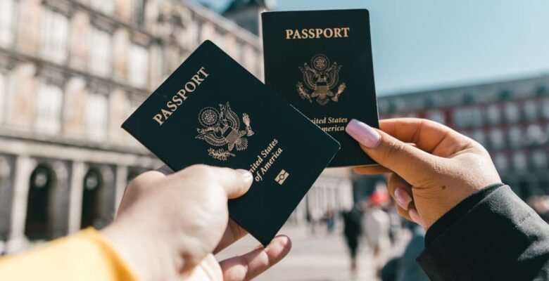 passports held up by hands in Europe