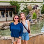 two women in front of a fountain at Alabama Coast Zoo