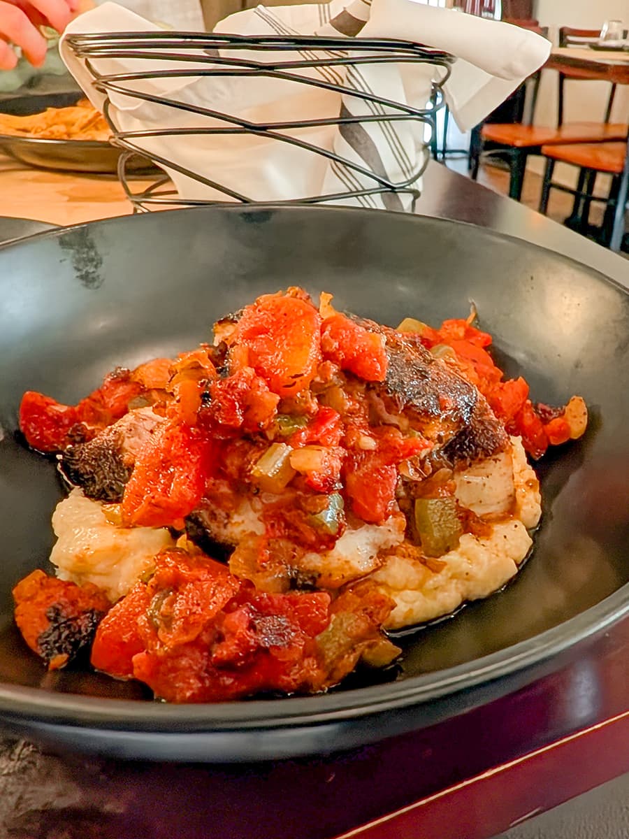 Redfish creole over grits