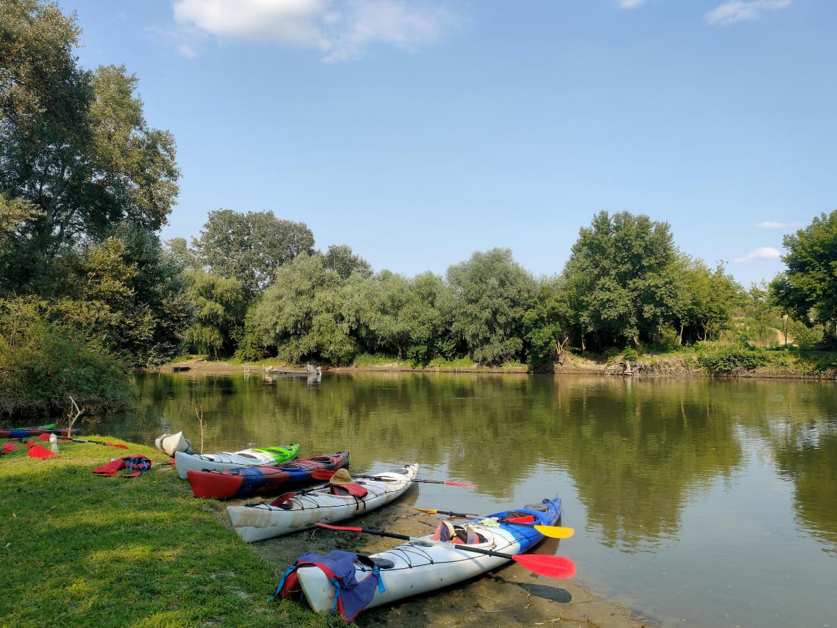 kayaks on shore of a calm lake