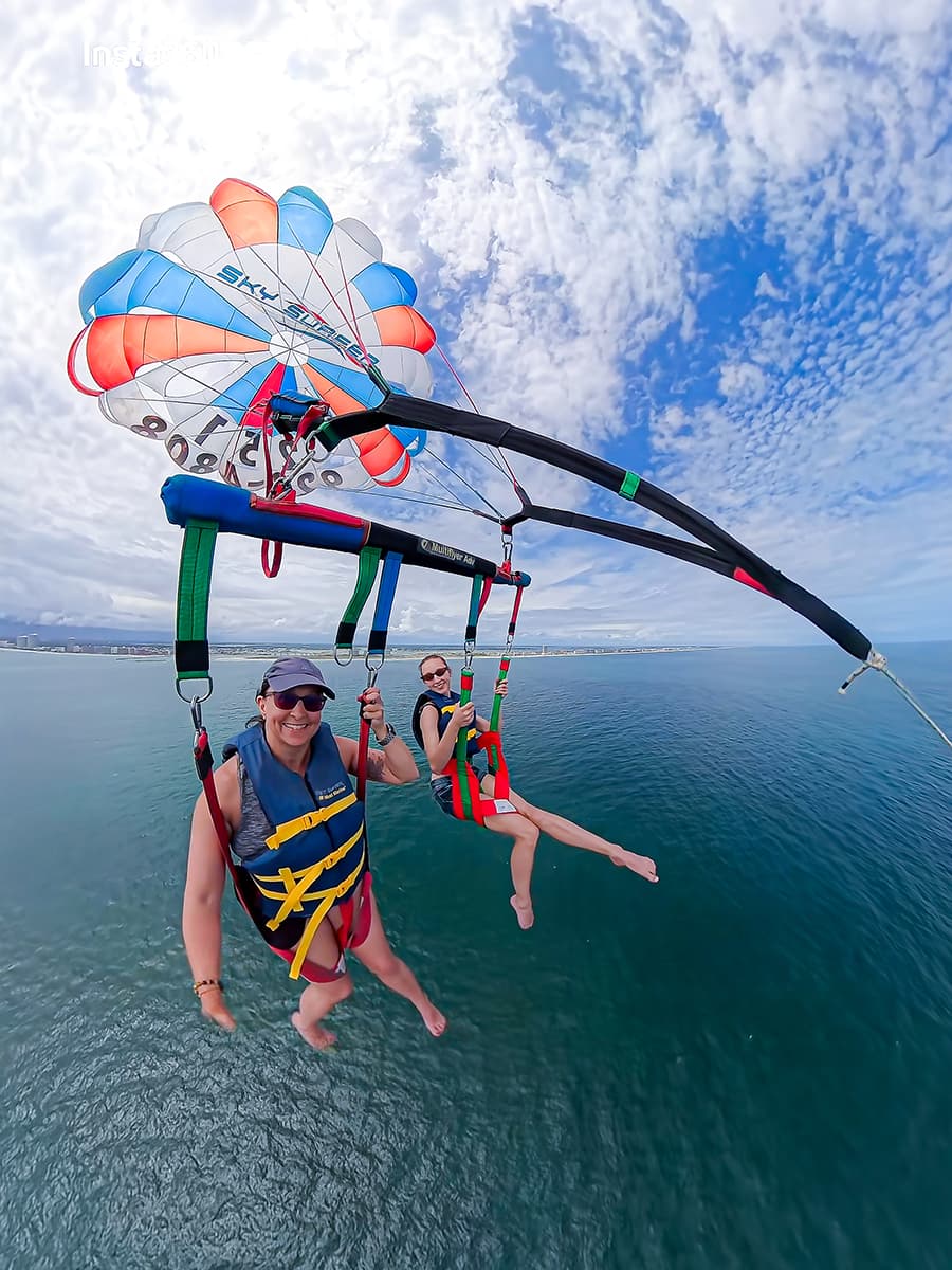 parasailing woman over Gulf of Mexico