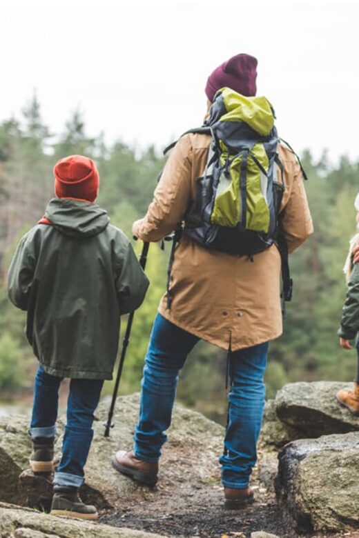 family hiking in woods