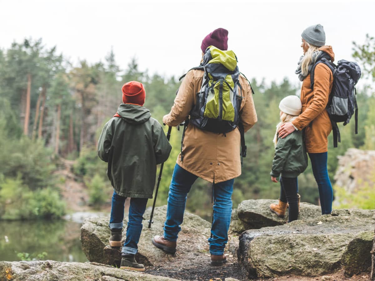 family hiking in woods