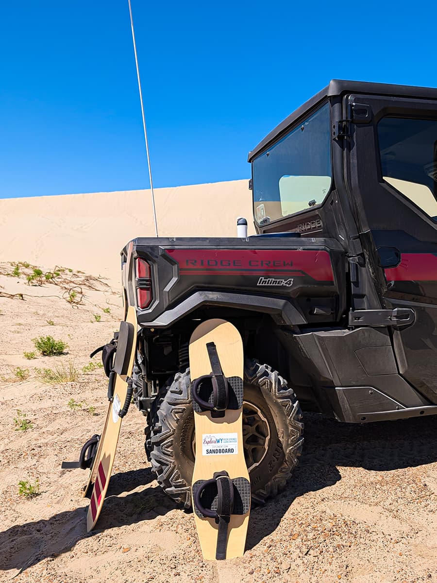 sand sled and surf board against a 4x4