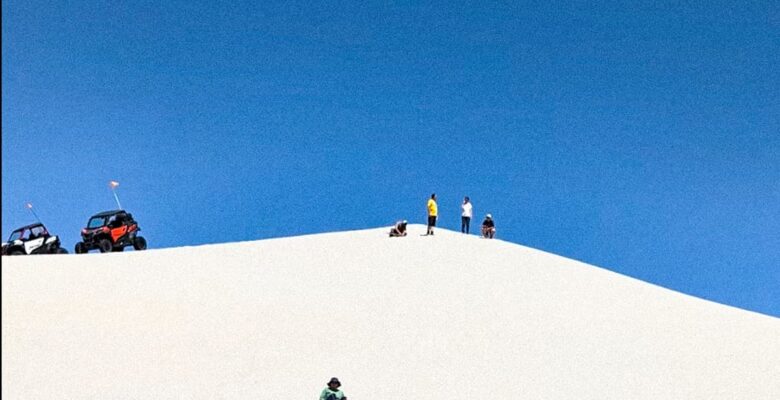 sandsledding on a sand dune