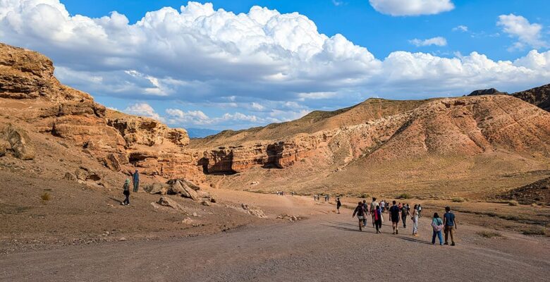 Charyn Canyon Valley of Castles - people walking into the canyon