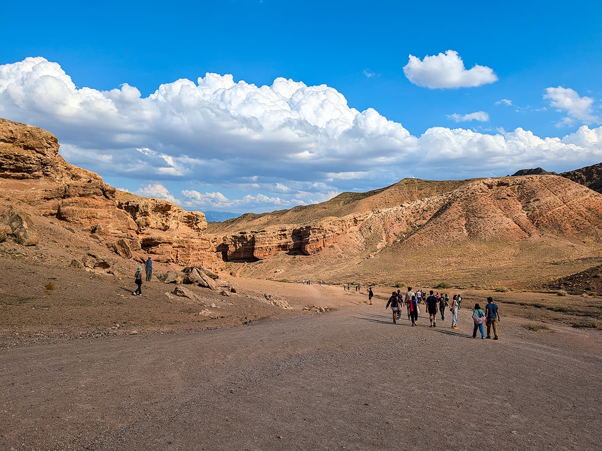 Charyn Canyon Valley of Castles - people walking into the canyon